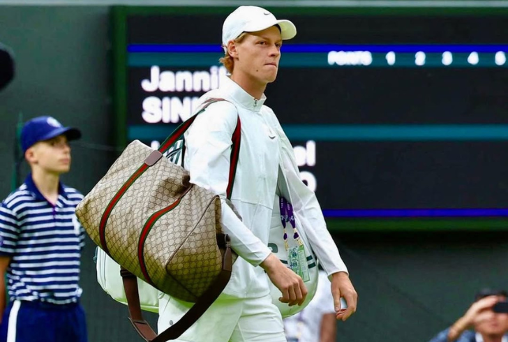 Jannik Sinner holding Gucci bag